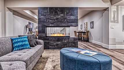 EcoSmart Fire Flex 50PN Flex Fireplace adds a modern ethanol peninsula hearth in a private living room, ventless luxury.